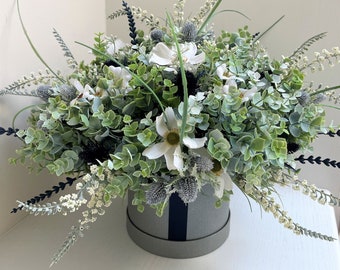 Navy luxury faux flower arrangement presented in a hat box finished with silk ribbon