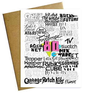 May include: A white card with black and pink text listing popular 80s movies, music, and cultural references. The text is arranged in a cloud-like shape with the number 80 in the center. The number 80 is pink with a yellow outline.