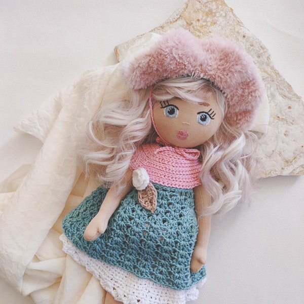 Cloth doll, rag doll. Rigid fabric doll, crocheted clothing.
