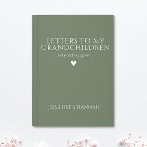 May include: A sage green hardback book titled "LETTERS TO MY GRANDCHILDREN" with the subtitle "As I watch you grow." The names Jess, Luke & Hannah are printed at the bottom. A white heart is centered on the cover.