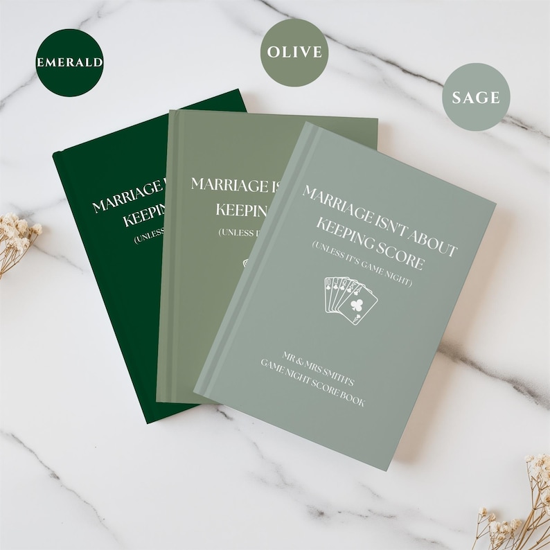 May include: Three hardcover score books in emerald, olive, and sage green. Each cover features the white text "MARRIAGE ISN'T ABOUT KEEPING SCORE (UNLESS IT'S GAME NIGHT)", a graphic of playing cards, and "MR & MRS SMITHS GAME NIGHT SCORE BOOK".