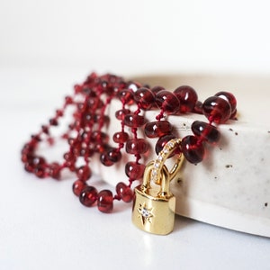 Hand-Knotted Red Silk Garnet Necklace, Gold Starburst Padlock Pendant