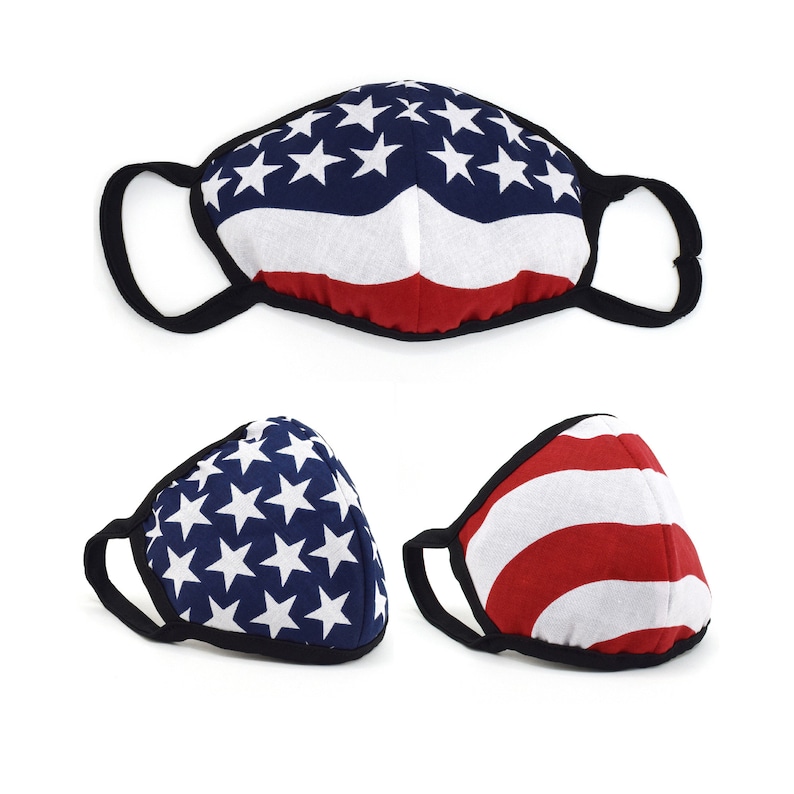 May include: Three face masks with an American flag design. The masks are black with a white and red American flag pattern. The masks are made of fabric and have elastic ear loops.