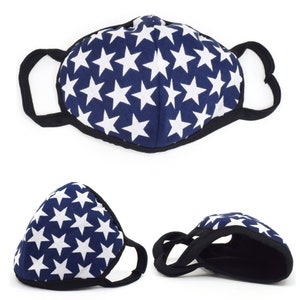 May include: A blue face mask with a white star pattern. The mask has elastic ear loops and a black trim.