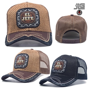 May include: A collection of trucker hats featuring a woven front panel and mesh back. Each hat displays a square patch with the text EL JEFE in the center. The brims are dark with decorative stitching, and the hats include an adjustable snapback.