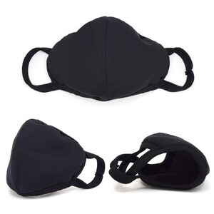 May include: Black face mask with adjustable ear loops. The mask is made of a soft, breathable fabric and is designed to provide a comfortable fit.