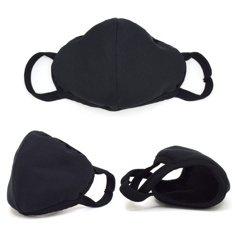 May include: Black face mask with adjustable ear loops. The mask is made of a soft, breathable fabric and is designed to provide a comfortable fit.