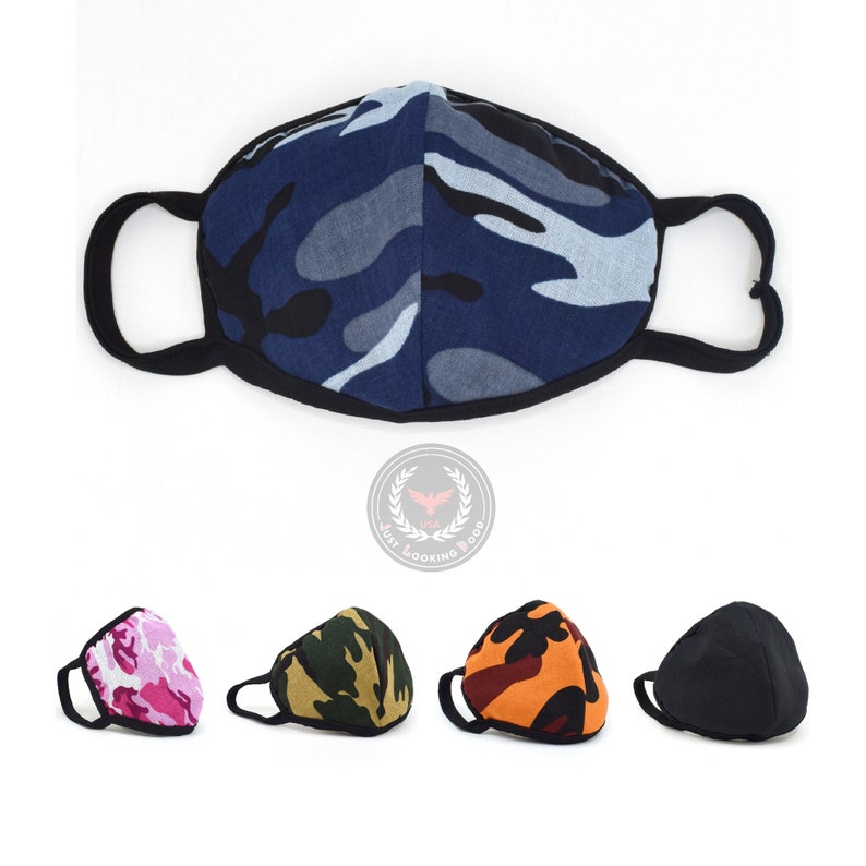 May include: Five face masks in different camouflage patterns. The masks are made of a soft, breathable fabric and have adjustable ear loops. The patterns include blue, pink, green, orange, and black.