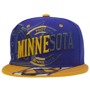 May include: A purple baseball cap with a flat yellow brim. The front features embroidered text reading MINNESOTA in large yellow and grey letters, with the word FOOTBALL arched above. A graphic design with yellow and white accents is on the brim.