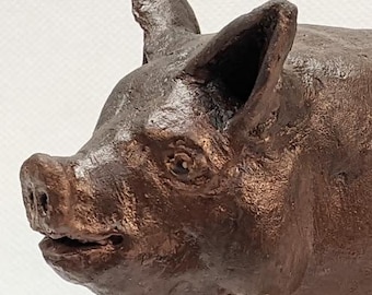 Stoneware Ceramic Pig Sculpture 6 1/2" X 5" X 4 1/2". This one of a kind sculpture was done from reference photographs at local farms.