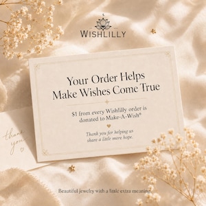May include: A rectangular cream-colored card with the text "Your Order Helps Make Wishes Come True" and "$1 from every Wishlilly order is donated to Make-A-Wish". The card features a logo with a lotus flower and the brand name "WISHLILLY".