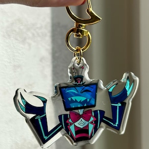 Vox, Lucifer & Alastor Hazbin Hotel Keychain - Perfect for fans! Enchanting design and decorative. Must-have for Hazbin Hotel enthusiast! Vox