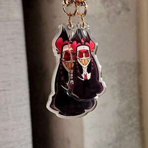 Vox, Lucifer & Alastor Hazbin Hotel Keychain - Perfect for fans! Enchanting design and decorative. Must-have for Hazbin Hotel enthusiast! image 8