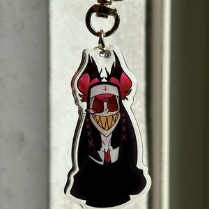 Vox, Lucifer & Alastor Hazbin Hotel Keychain - Perfect for fans! Enchanting design and decorative. Must-have for Hazbin Hotel enthusiast! Nune Alastor