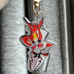 Vox, Lucifer & Alastor Hazbin Hotel Keychain - Perfect for fans! Enchanting design and decorative. Must-have for Hazbin Hotel enthusiast! Lucifer