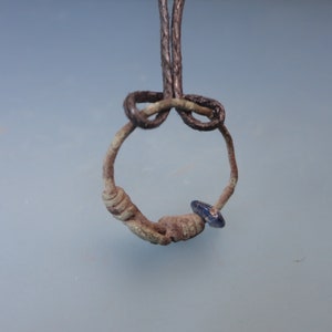 Ancient Primitive Bronze Amulet with Glass Blue Stone. Pagan Artifact of Przeworsk Culture from the 2-4th century AD