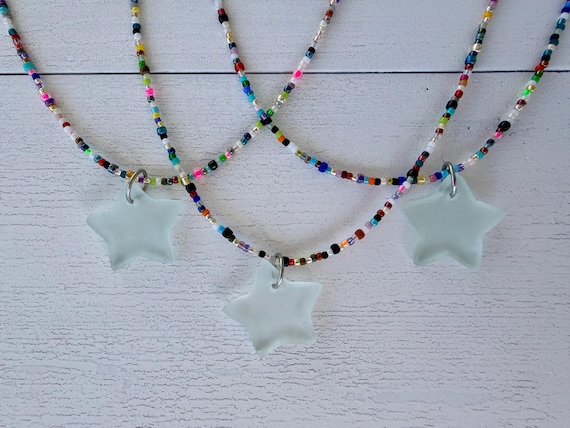 Colorful beaded necklace with glass star pendant, petite rainbow beads, frosted clear Thai star.