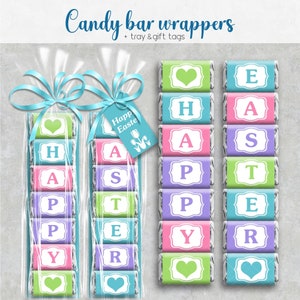 Op de afbeelding: Een set bedrukbare chocolade reep verpakkingen met het woord "Happy Easter" gespeld in kleurrijke letters. De verpakkingen zijn ontworpen om te worden afgedrukt en uitgeknipt om om standaardformaat chocolade repen te wikkelen.