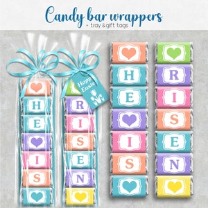Op de afbeelding: Een set pastelkleurige chocoladeverpakkingen met de woorden "Happy Easter" en de letters "RISEN" erop. De verpakkingen zijn bedoeld om te gebruiken voor een chocoladecadeau.