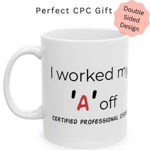 May include: White ceramic mug with a curved handle. The mug features the text "I worked my 'A' off" with a red 'A'. The words "CERTIFIED PROFESSIONAL CODE" are printed below. The mug has a double-sided design.
