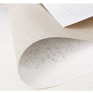 May include: A white canvas with a paint-by-numbers design printed on it. The canvas is rolled up and the design is visible on the edge.