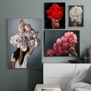 May include: Four abstract art prints featuring women with floral arrangements on their heads. The prints are in a modern style and feature a variety of colors, including pink, red, white, and gray.