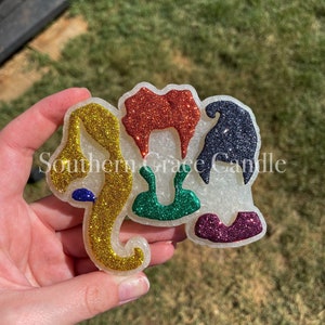 May include: A rainbow glitter elephant charm with the text "Southern Grace Candle" on the side.