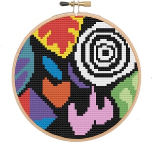 Könnte beinhalten: Ein farbenfrohes abstraktes Kreuzstichmuster mit schwarzem Hintergrund. Das Design zeigt eine Vielzahl von Formen und Farben, darunter Rot, Orange, Gelb, Grün, Blau, Lila und Pink.