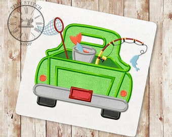 May include: Green pickup truck with a fishing rod, net, bucket, and fish in the bed. The truck has a red license plate.