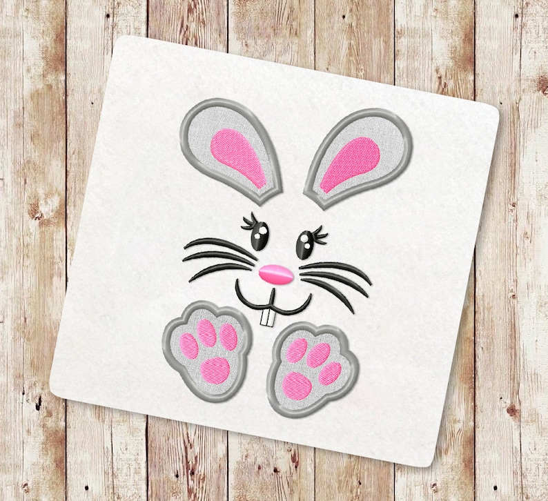 May include: Embroidered design of a gray bunny rabbit with pink ears, nose, and paw prints. The bunny has black whiskers and black eyes.