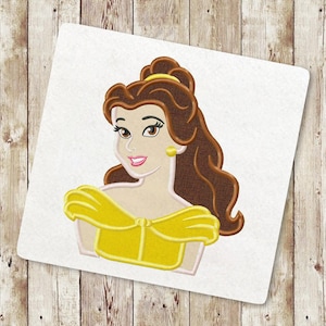 May include: Embroidered design of Belle from Beauty and the Beast. She has long brown hair, a yellow dress, and a warm smile.