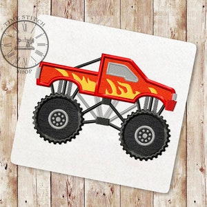 May include: Red monster truck with black tires and flames on the side. The truck is a digital embroidery design.