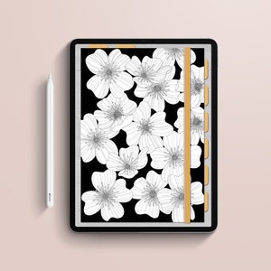 May include: A digital planner on a tablet featuring a black background with white floral illustrations. The planner has a gold elastic band and tabs. A white stylus is positioned to the left. The text "utopic PAPER" is at the bottom.