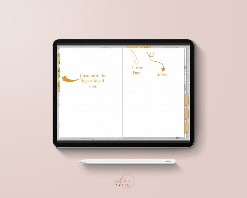 May include: A digital planner displayed on a tablet with a white stylus. The planner has customizable tabs and a cover page. The text on the screen includes "Cover Page" and "Index". The background is a soft pink.