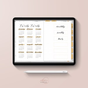 May include: A digital planner displayed on a tablet, featuring a 2020 calendar and organizational sections labeled "Monthly", "Weekly", and "Daily". The planner has a gold and white color scheme, with a stylus resting below. The text "utopie PAPER" is visible.