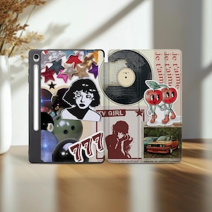 May include: A white ceramic mug with a black handle and the text "But First, Coffee" in a bold, black font. The mug is set against a blurred background, suggesting a cozy setting.