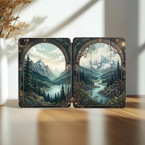 May include: An iPad case featuring a scenic landscape design. The case is split into two panels, each depicting a mountain range, river, and forest scene within an arched frame. The color palette includes greens, blues, and browns.