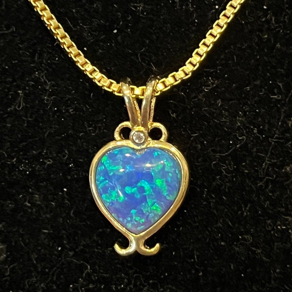 Opal doublet gold 16 necklace on box chain. This is so pretty on and the colors are very blue and green. One carat and a half!