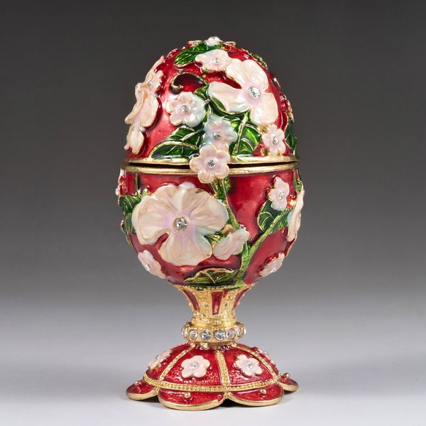 Faberge egg with pink cherry blossoms This is a dark red and light pink Swarovski crystal egg with amazing detail 4” tall, gift, collectible