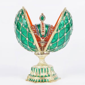 Luck of the Irish Green Faberge egg in green with crown inside.This is collection of Swarovski crystals.Beautiful color crown is 1” egg 5”