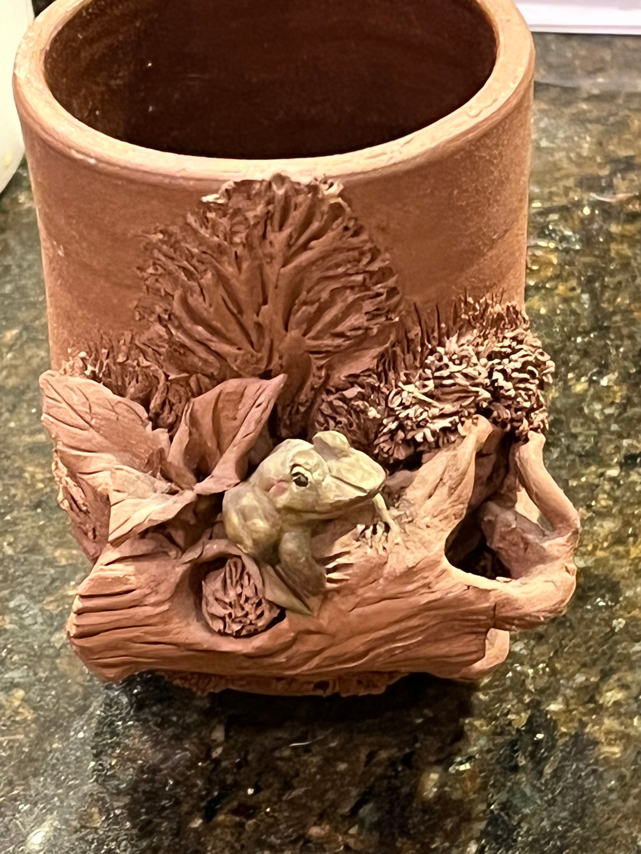 j hale frog on branch cup pottery This piece is from a noted sculpture making a green frog on the outside of a thrown pottery piece.3”3”3”