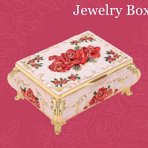 Gold and Red musical jewelry box - red floral motif colored with red roses on cream box. Plays the tune Once Upon a December from Anastasia