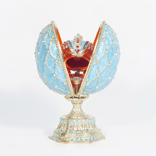Sky Blue Faberge egg in with matching crown inside.This is lace collection Swarovski crystals.Beautiful color crown is 1” egg 5” gift decor