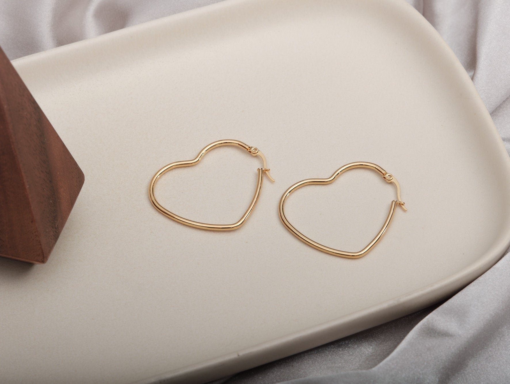 Gold heart shop shaped hoop earrings