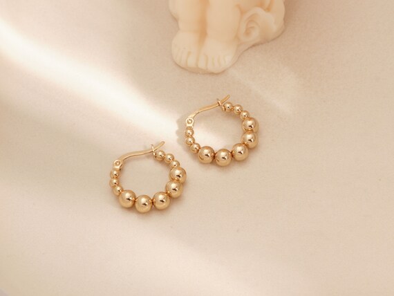 Gold beaded best sale earrings