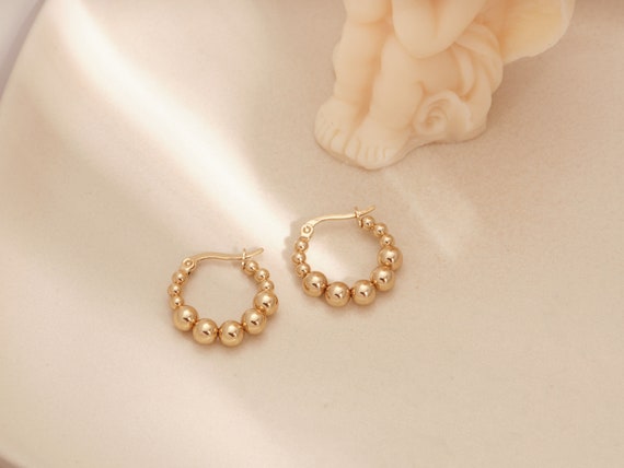Gold beaded best sale earrings
