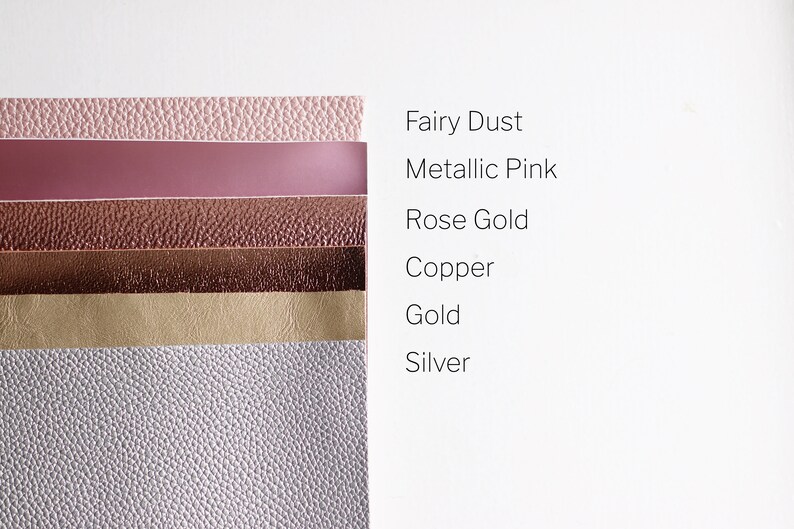 May include: A stack of six different coloured faux leather sheets. The colours are: fairy dust, metallic pink, rose gold, copper, gold, and silver.