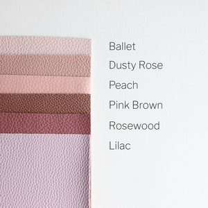 May include: Six swatches of faux leather in various shades of pink and brown. The swatches are labeled from top to bottom: Ballet, Dusty Rose, Peach, Pink Brown, Rosewood, and Lilac.