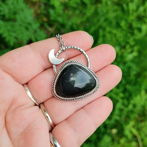Rainbow Obsidian mountain with crescent moon