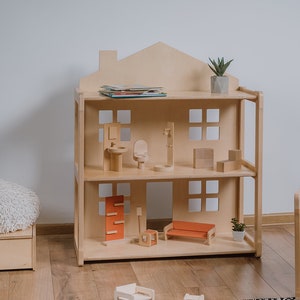 On the picture is our KIKI dollhouse, with a unique design, which let's children to play with dolls. After your child is a toddler the dollhouse can be used as a shelf for books, photos or other items.